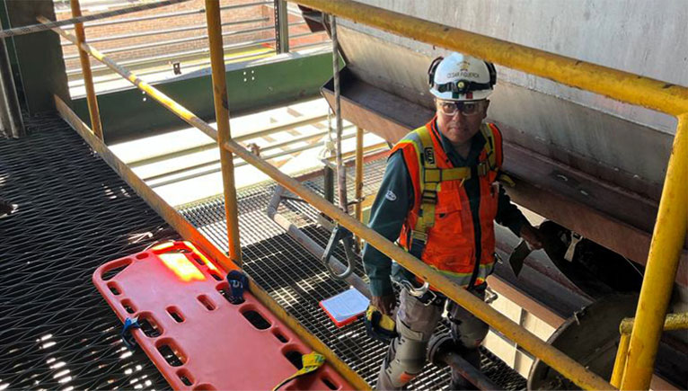 man with hardhat on a lift