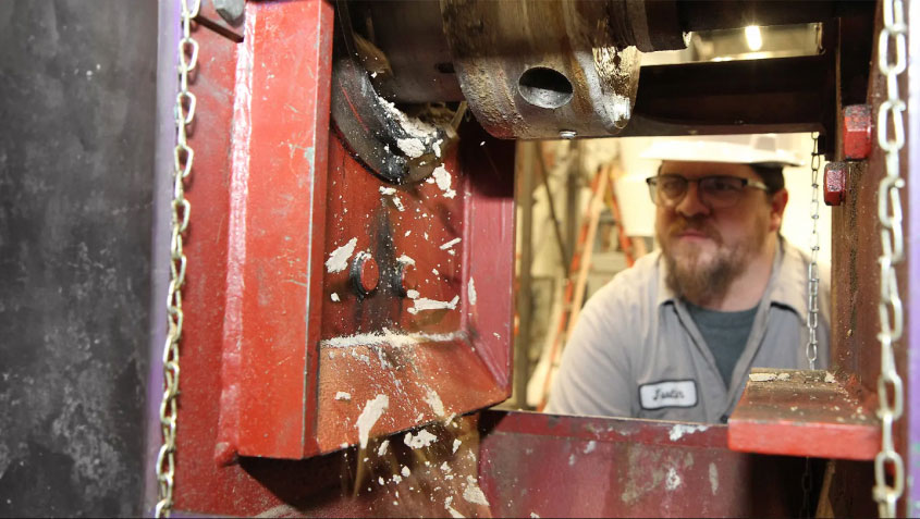 man working with machinery